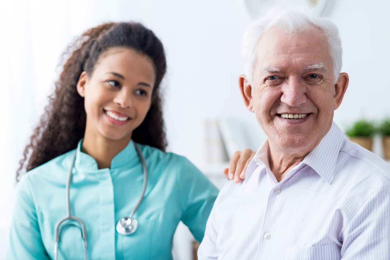 Healthcare nurse with an older man.