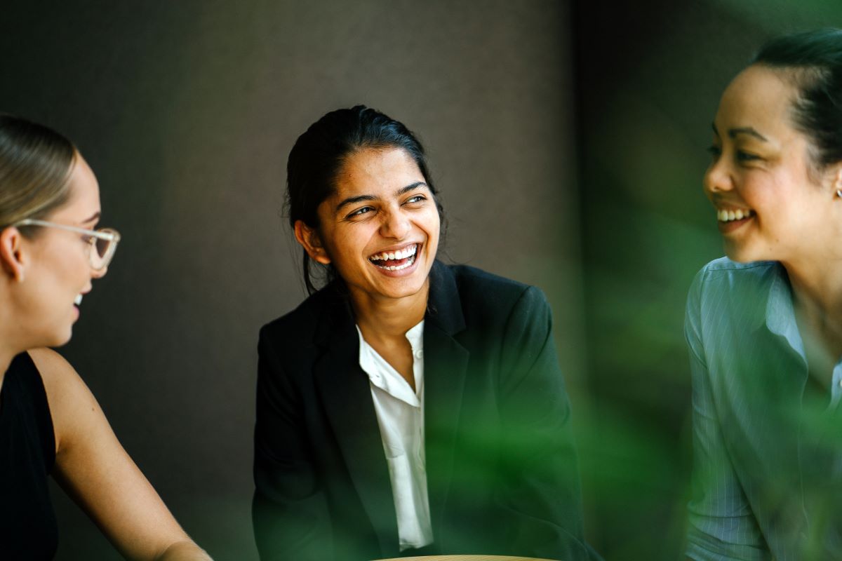 women talking happily