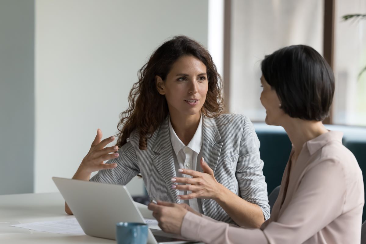 two female consultants speaking