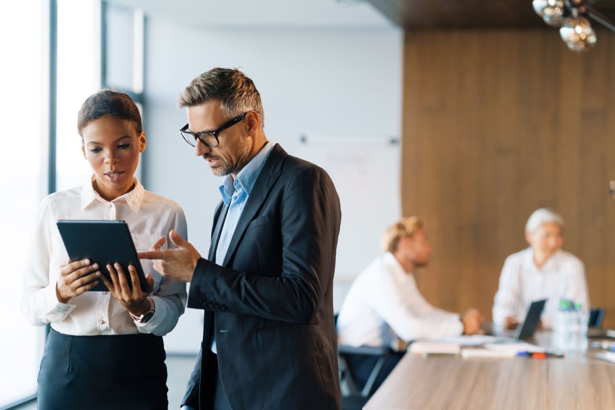 two business people speaking to each other