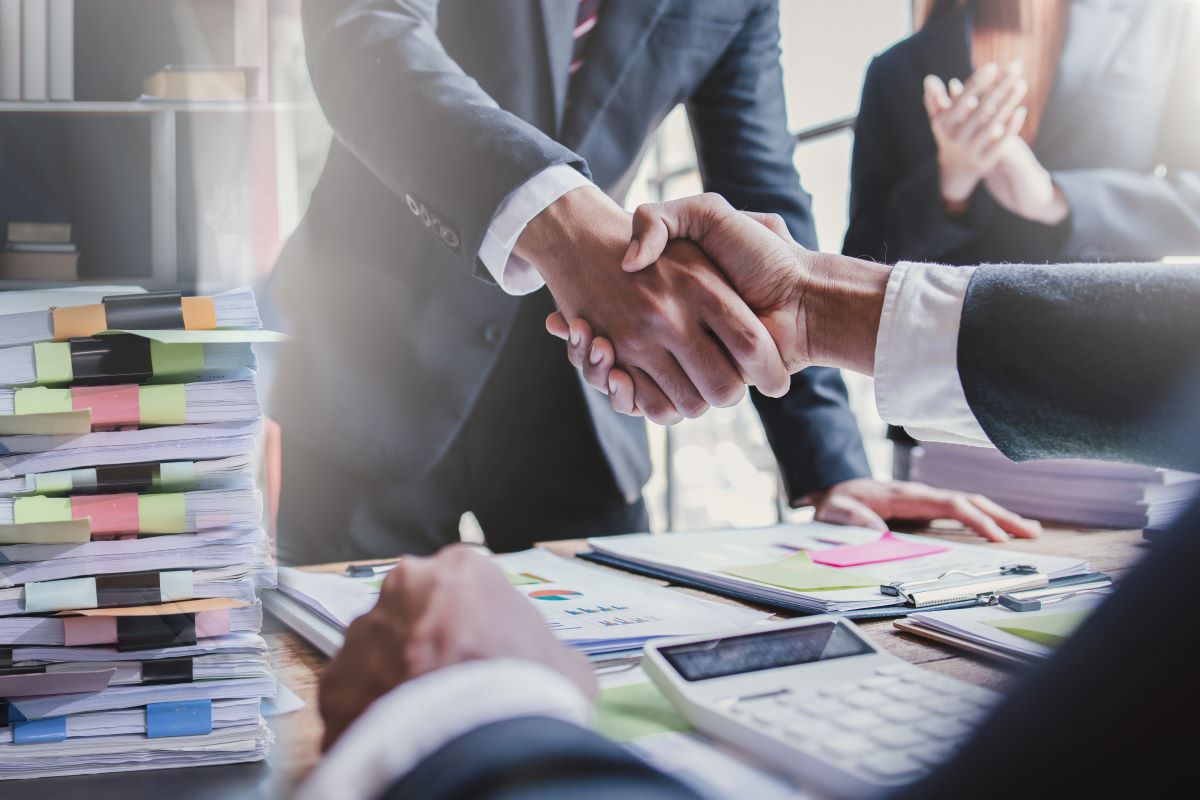 Business handshake for teamwork of business merger and acquisition